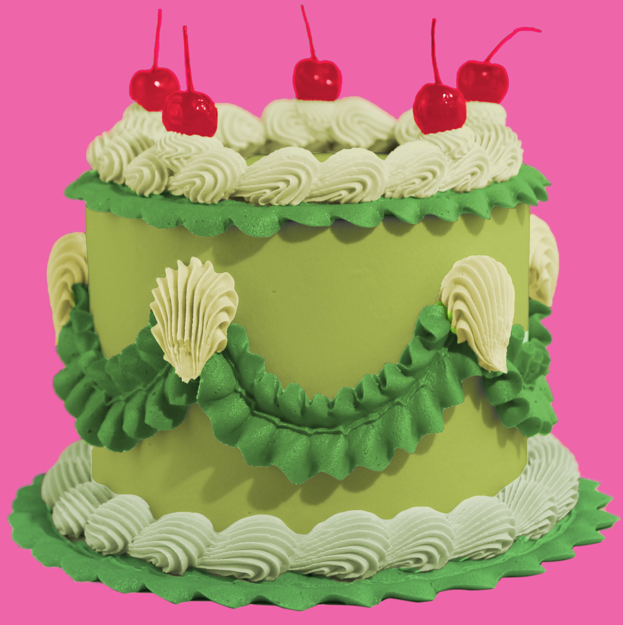Green wedding cake with white icing and cherries